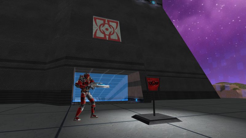 Player guarding a base entrance beside a team banner