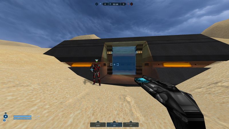 Teammate in red armor guarding a desert base entrance with a glowing forcefield door